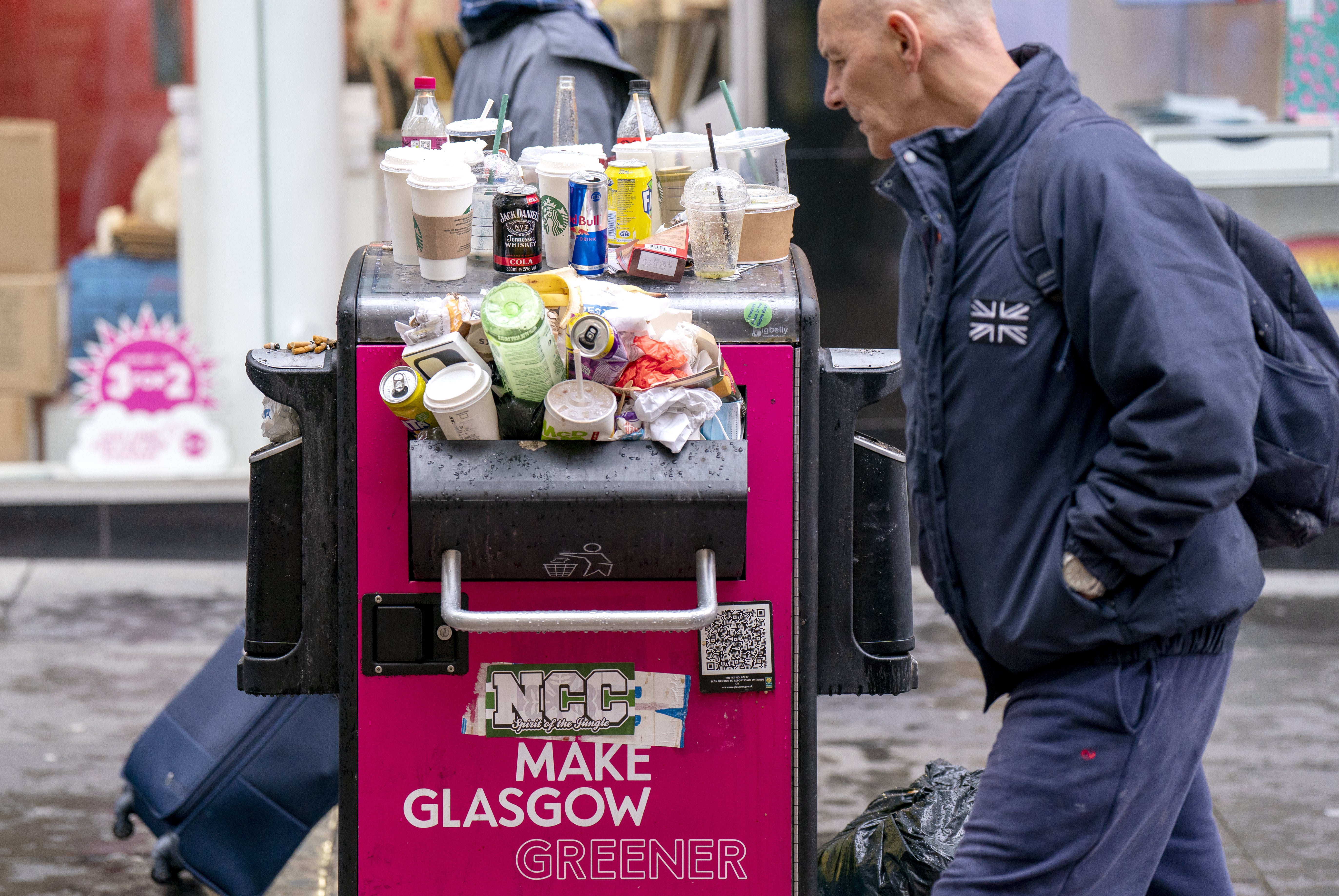 Bins along Glasgow’s Buchanan Street overflow with rubbish (Jane Barlow/PA)