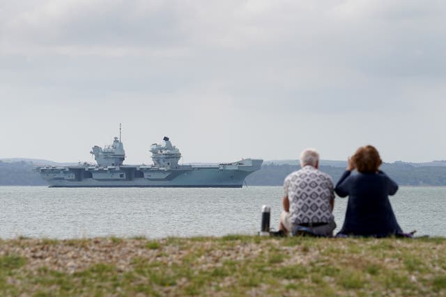 Aircraft carrier HMS Prince of Wales sits off the coast of Gosport, Hampshire (Gareth Fuller/PA)