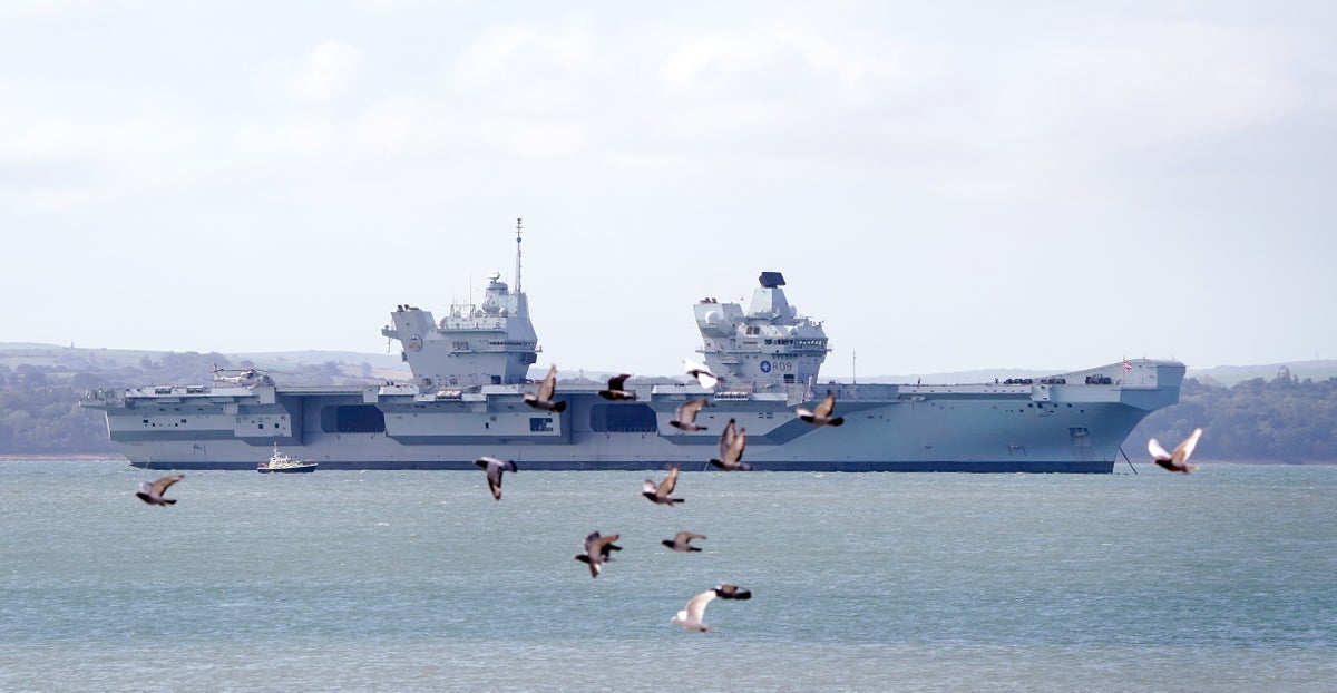 Broken down Royal Navy aircraft carrier returns to home base ahead of repairs