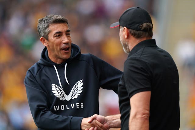Wolves boss Bruno Lage, left, is the happier manager after his side’s first league win of the season against Southampton (Tim Goode/PA)
