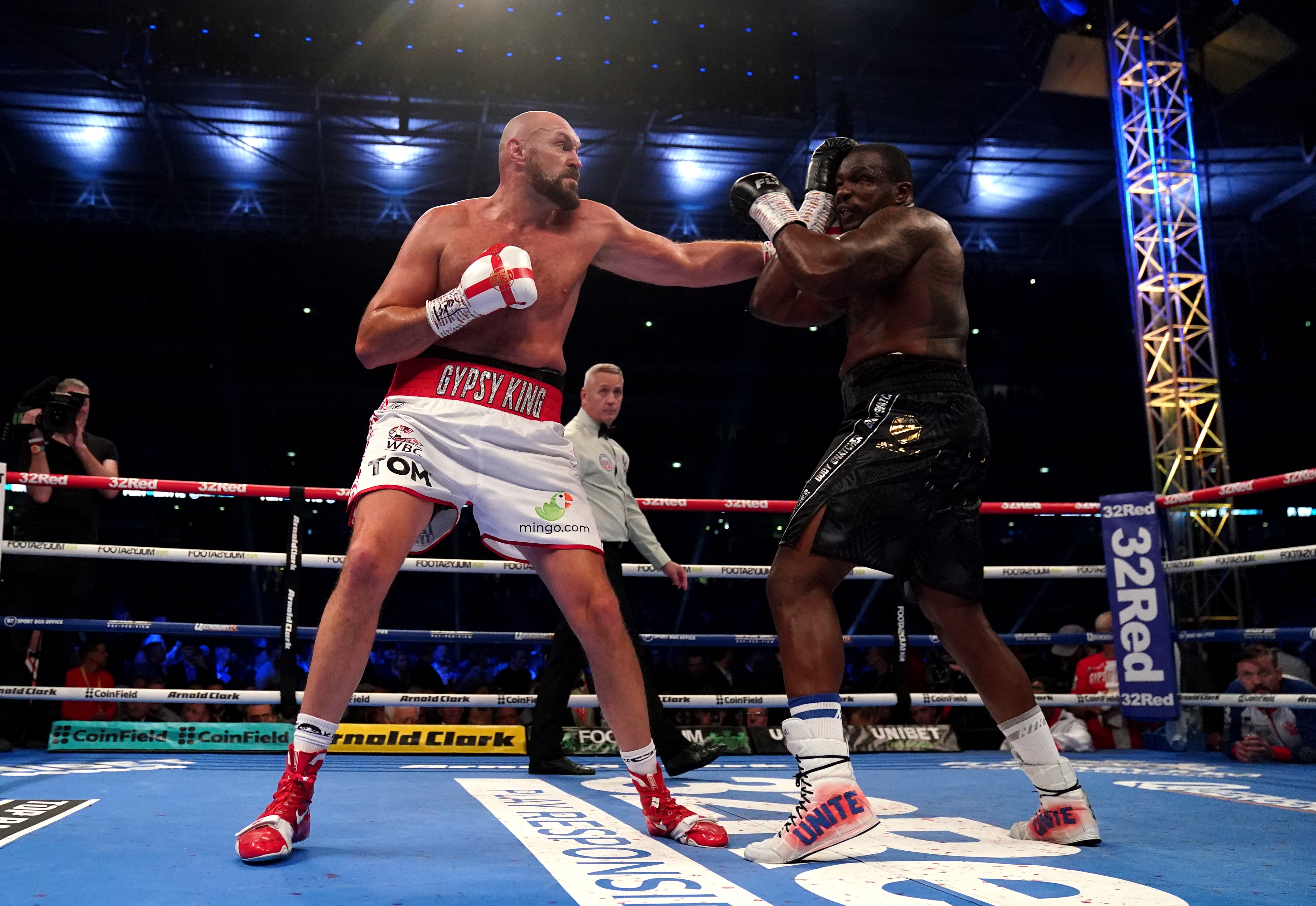 Tyson Fury (left) knocked out Dillian Whyte last time out, at Wembley Stadium