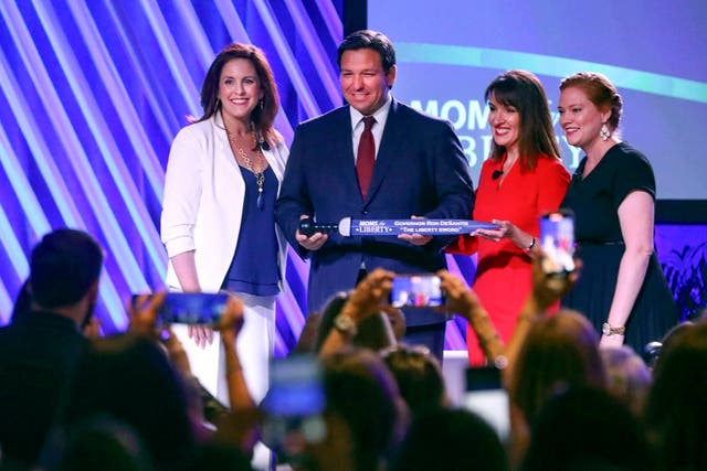 <p>Moms for Liberty members present Ron DeSantis with ‘liberty sword’ in 2022 </p>
