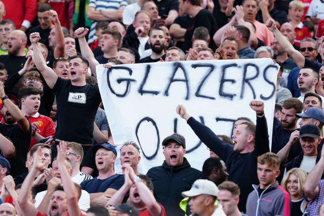 Manchester United fans wave anti-Glazer banners in the stands during the Premier League match at Old Trafford on Saturday (Martin Rickett/PA)