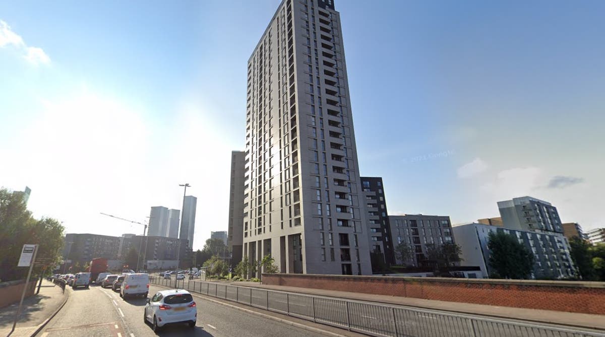 Woman survives 40ft plunge from third floor balcony as man arrested after 2am fall