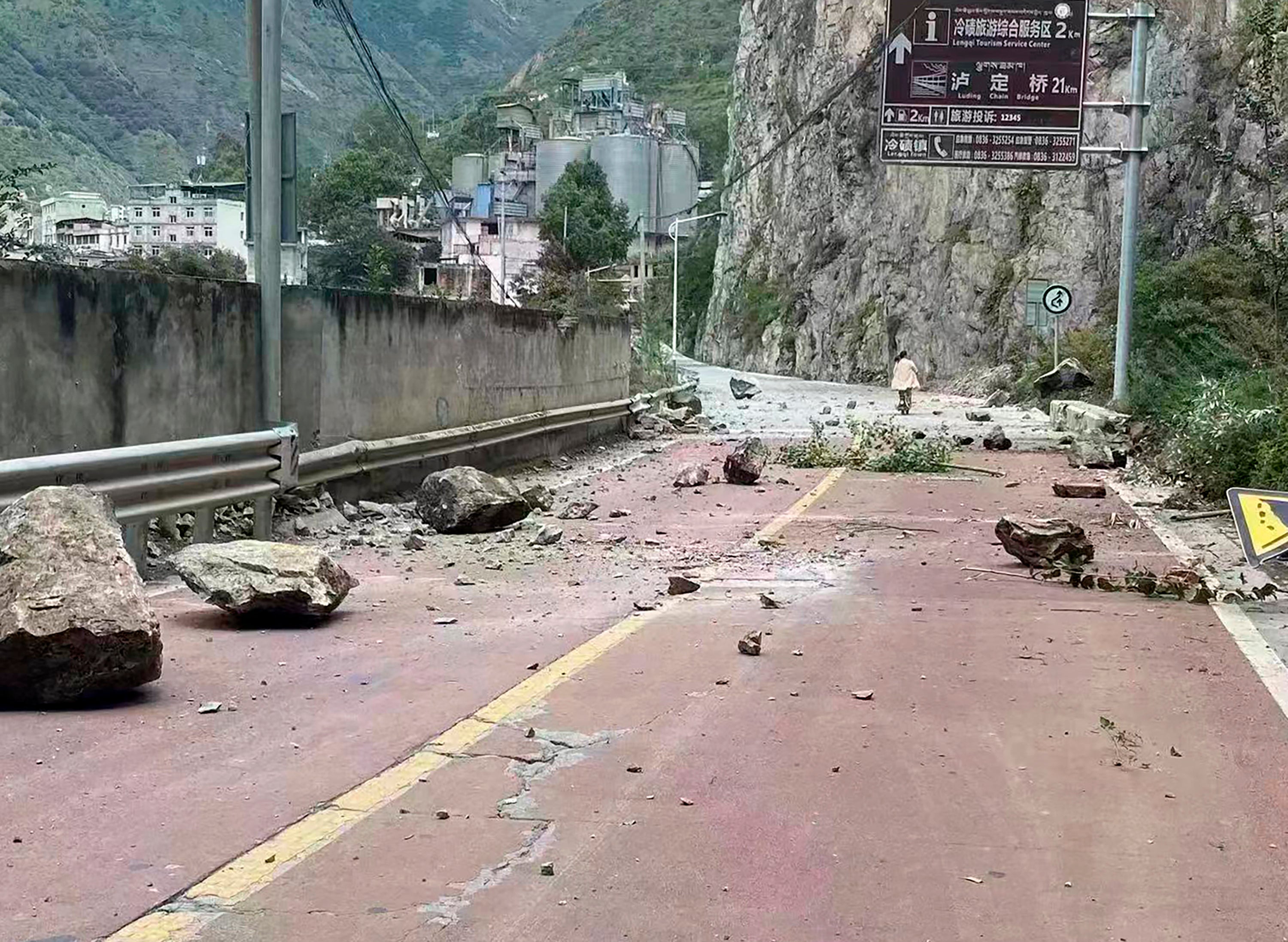 Fallen rocks are seen on a road near Lengqi Town in Luding County, Sichuan after a strong earthquake on 5 September