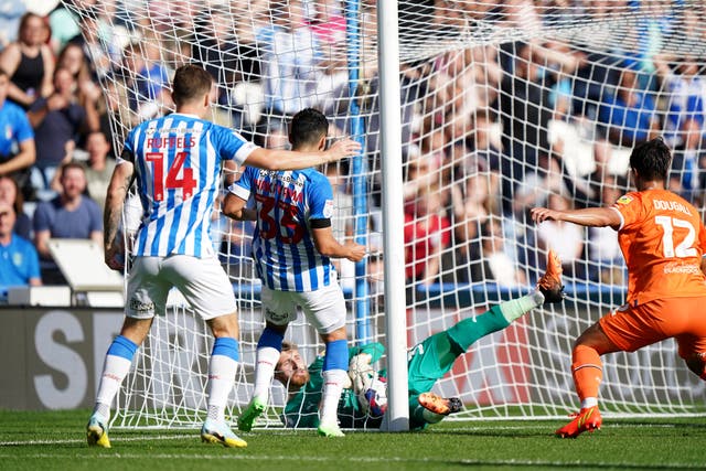 Huddersfield’s Yuta Nakayama was denied an equaliser when goal-line technology failed to detect his effort against Blackpool had crossed the line (PA)