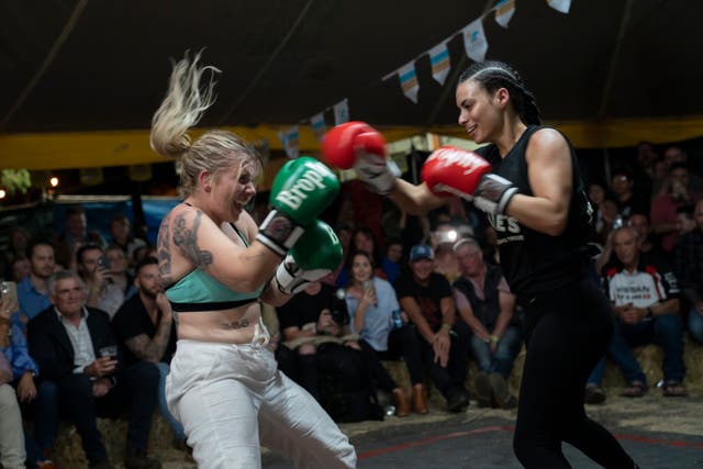 <p>Soraya ‘Miss Mauler’ Johnston (right) fights a volunteer from the audience</p>