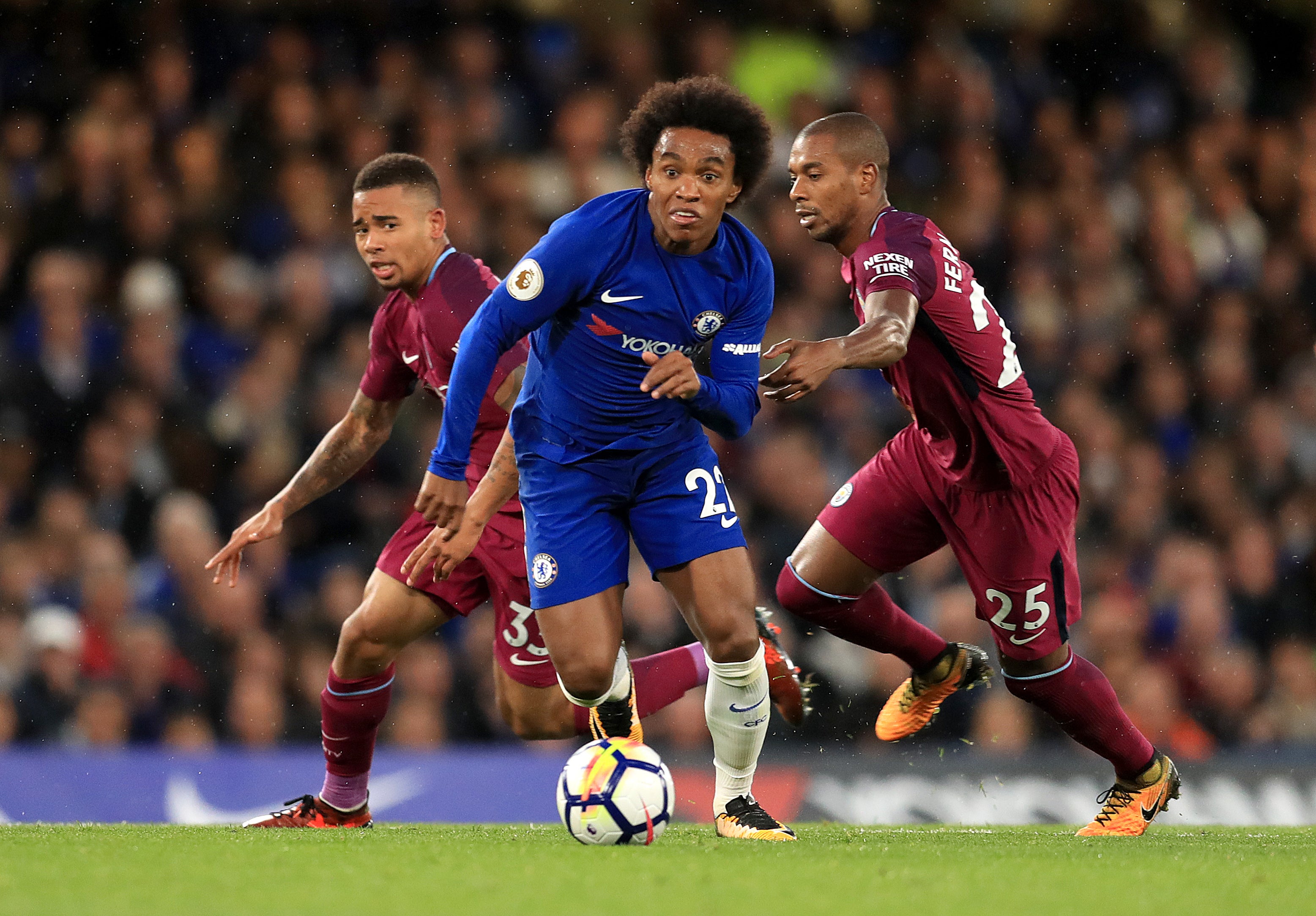 Willian, centre, is coming for the record held by Fernandinho, right (Adam Davy/PA)