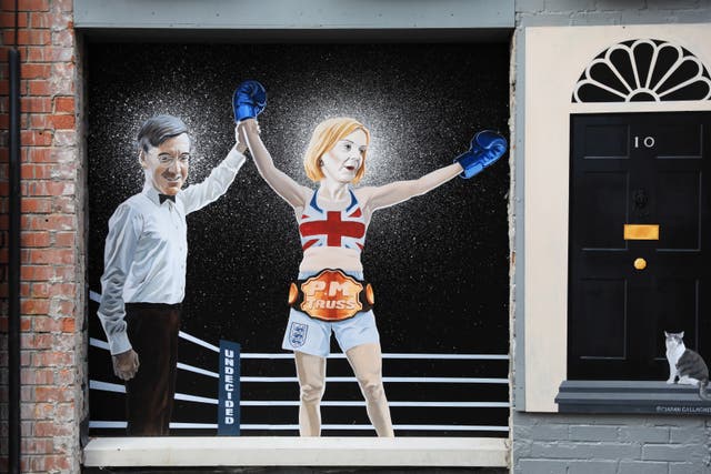 A Belfast mural depicting the Tory leadership fight has been updated to acknowledge Liz Truss’s victory (Peter Morrison/PA)
