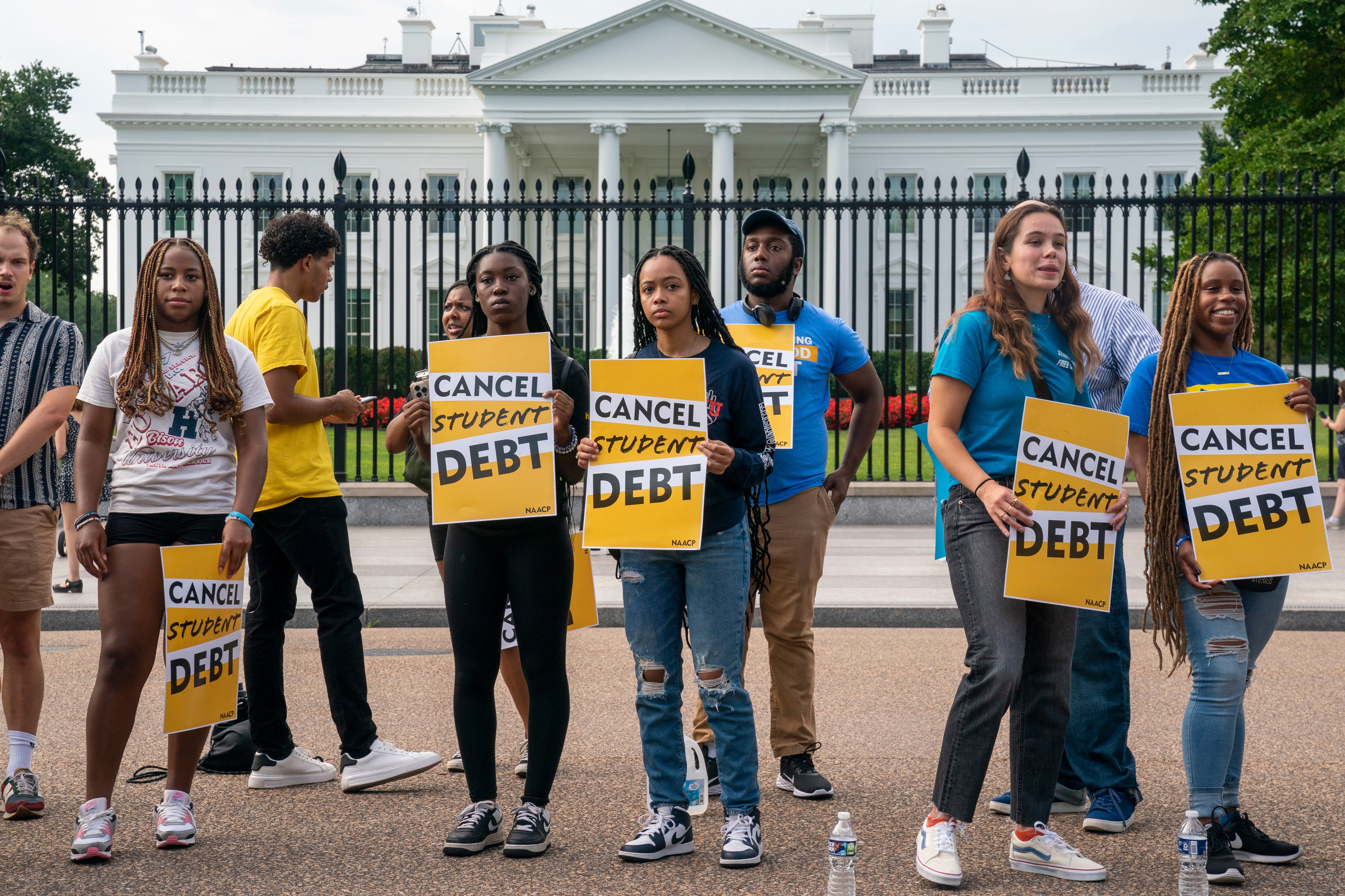 Student loan debt advocates rally outside the White House on 24 August.