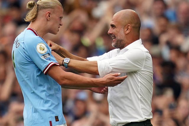 Pep Guardiola (right) has tried to downplay expectations of Erling Haaland (left) in the Champions League (Nick Potts/PA)