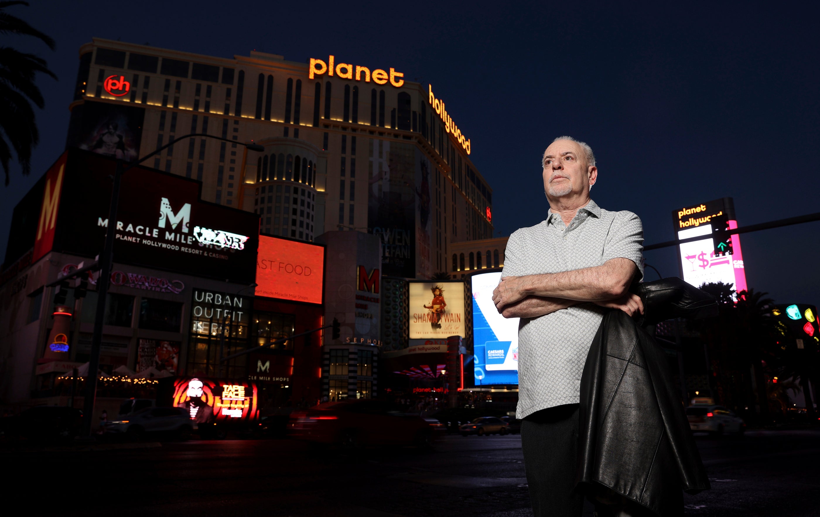 Jeff German, host of “Mobbed Up,” poses with Planet Hollywood in the background on the Las Vegas Strip