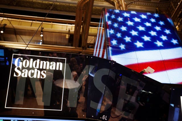 <p>The Goldman Sachs logo displayed on a post above the floor of the New York Stock Exchange</p>