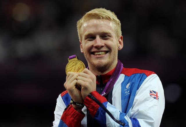 Jonnie Peacock displays the gold medal he won in the men’s 100m – T44 final at London 2012 (Anthony Devlin/PA)