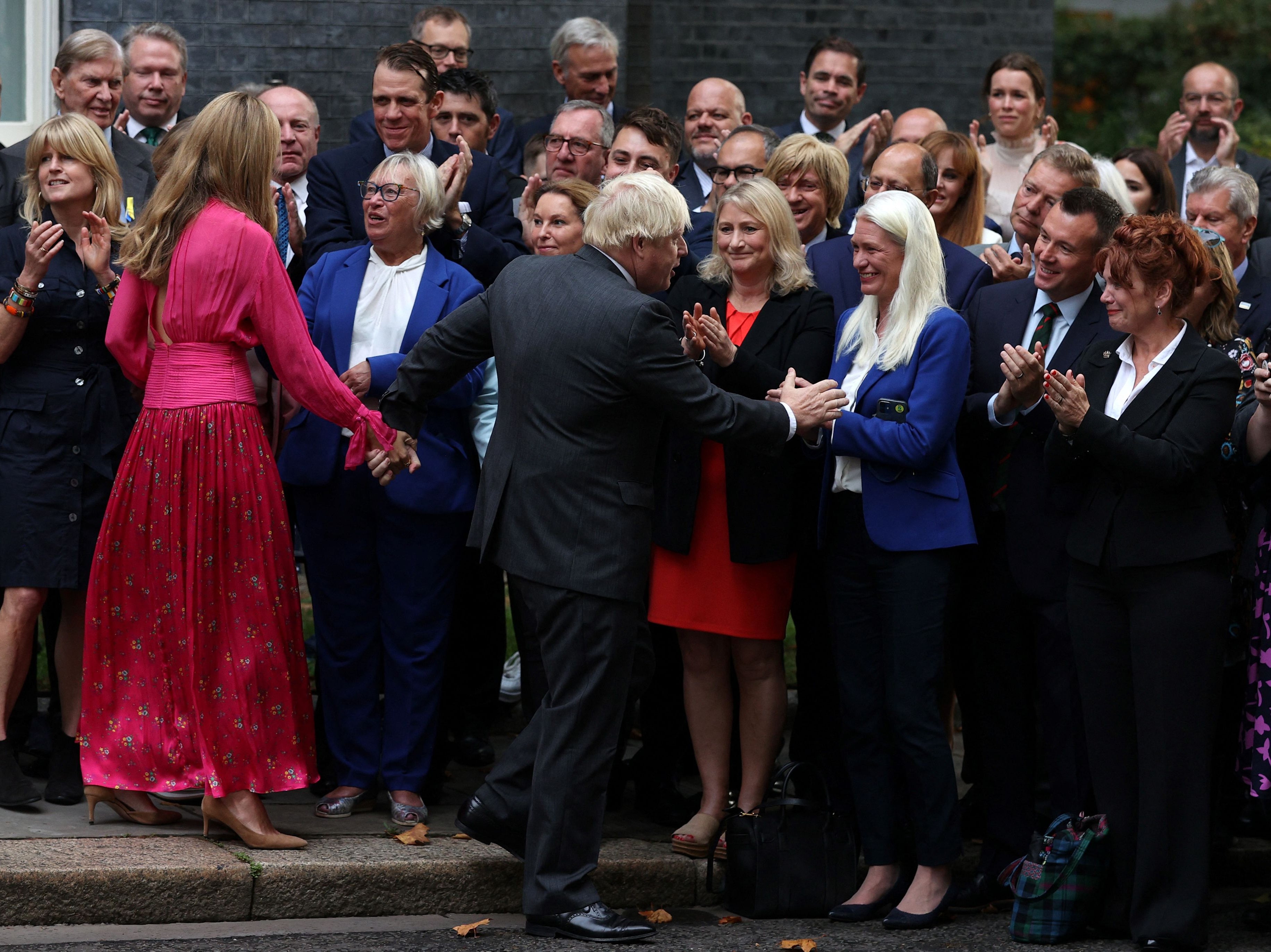 Boris Johnson and his wife Carrie say goodbye to the crowd