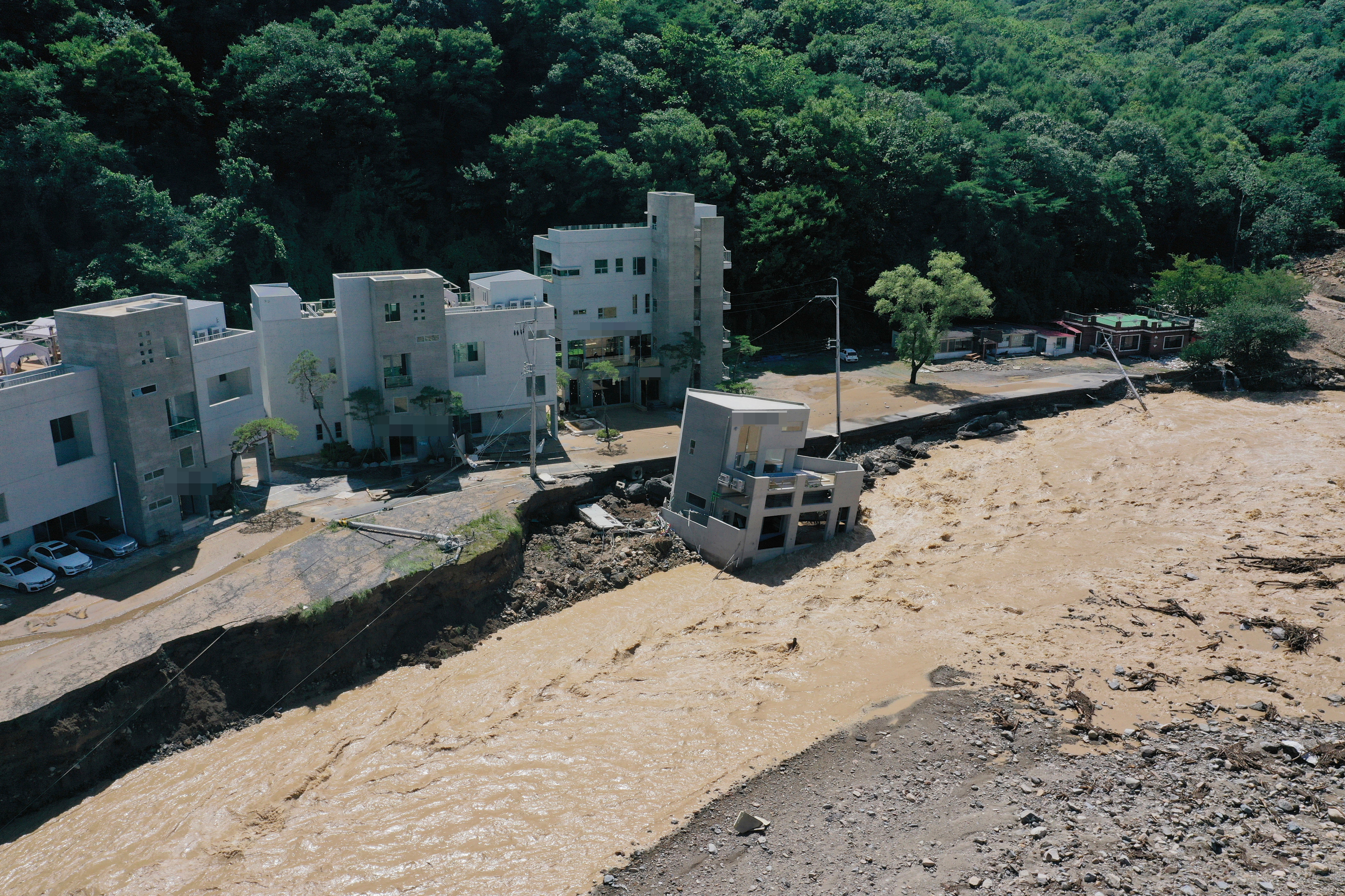 A building is swept down in the aftermath of Typhoon at a village in Pohang
