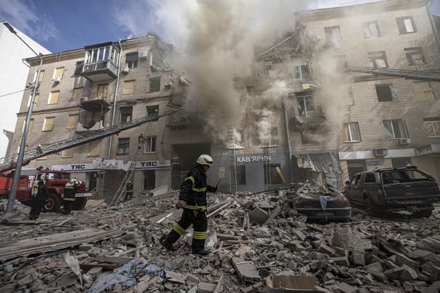 <p>Firefighters put out a fire caused by a Russian missile strike in Kharkiv, Ukraine, on 6 September</p>