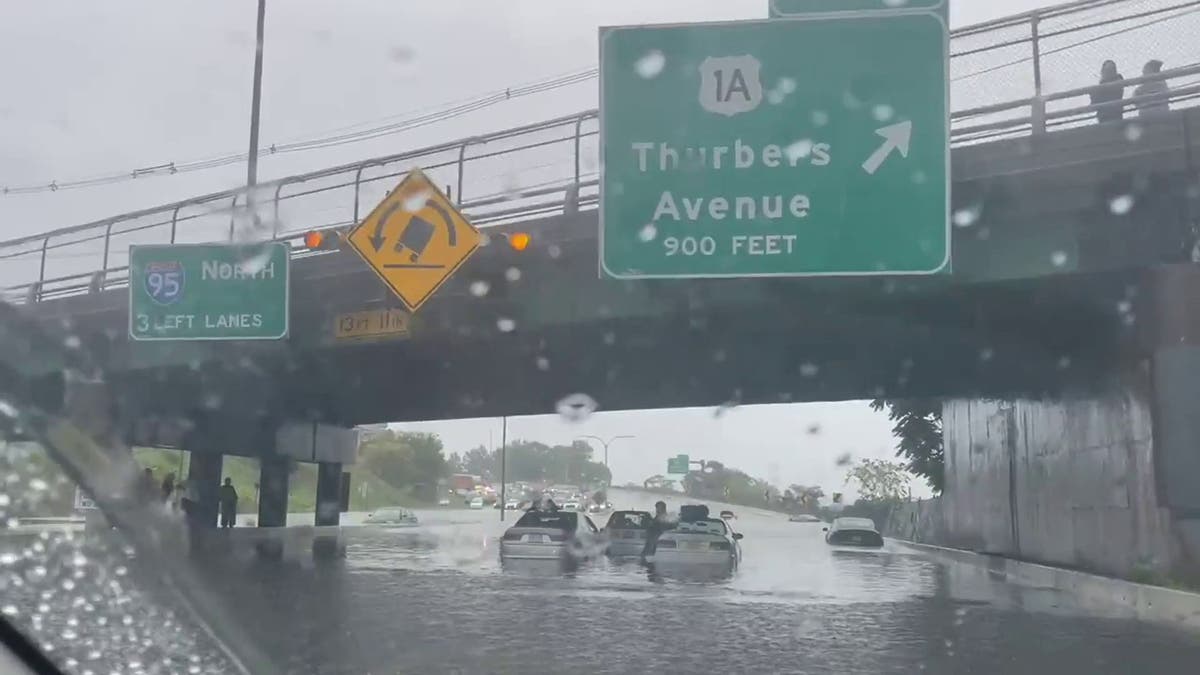 Rhode Island flooding Buildings collapse and cars submerged as storms