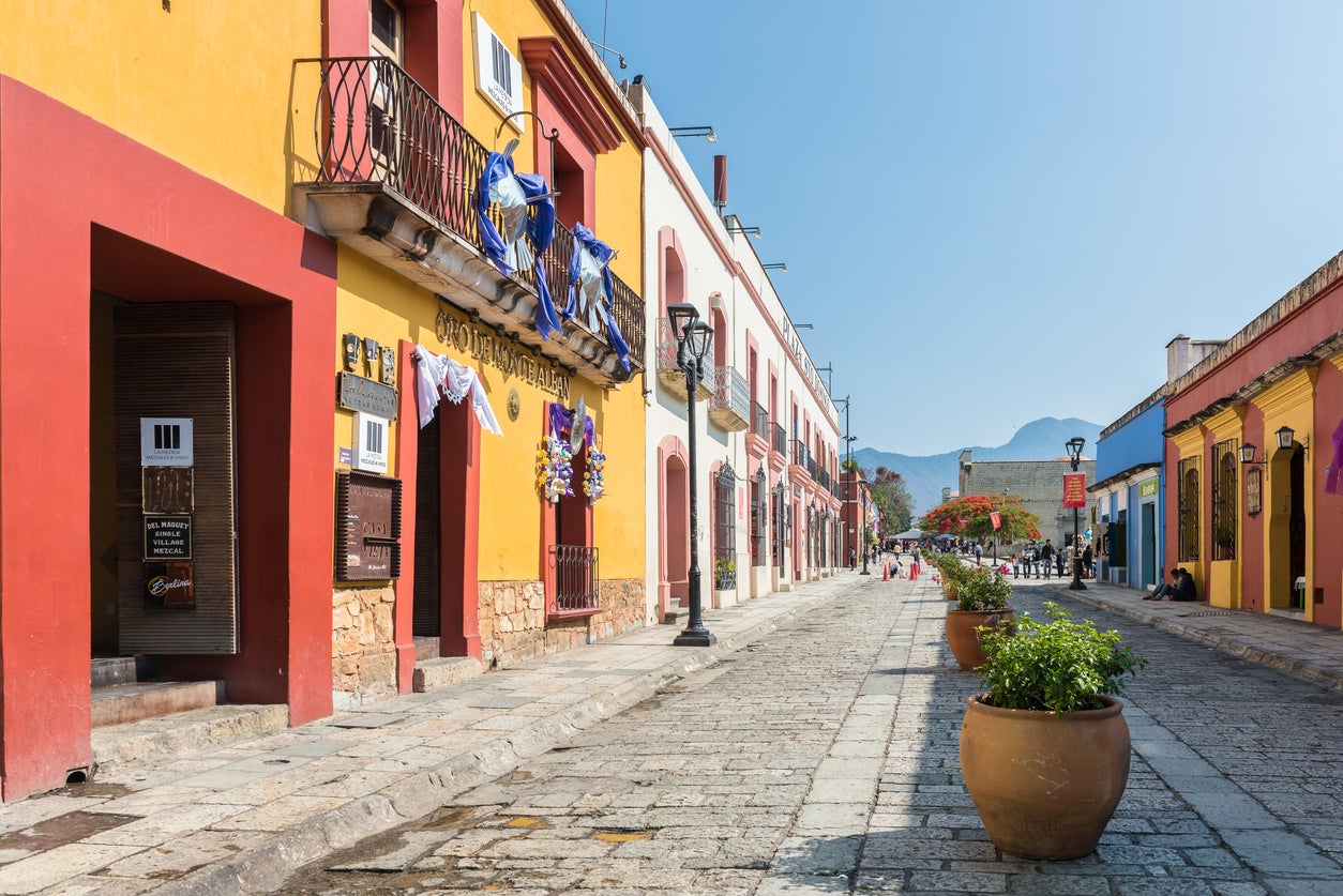 A colourful, low-rise street typical of Oaxaca, Mexico