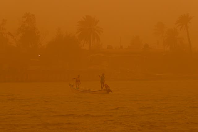 <p>Fishermen in a sandstorm in Basra, Iraq</p>