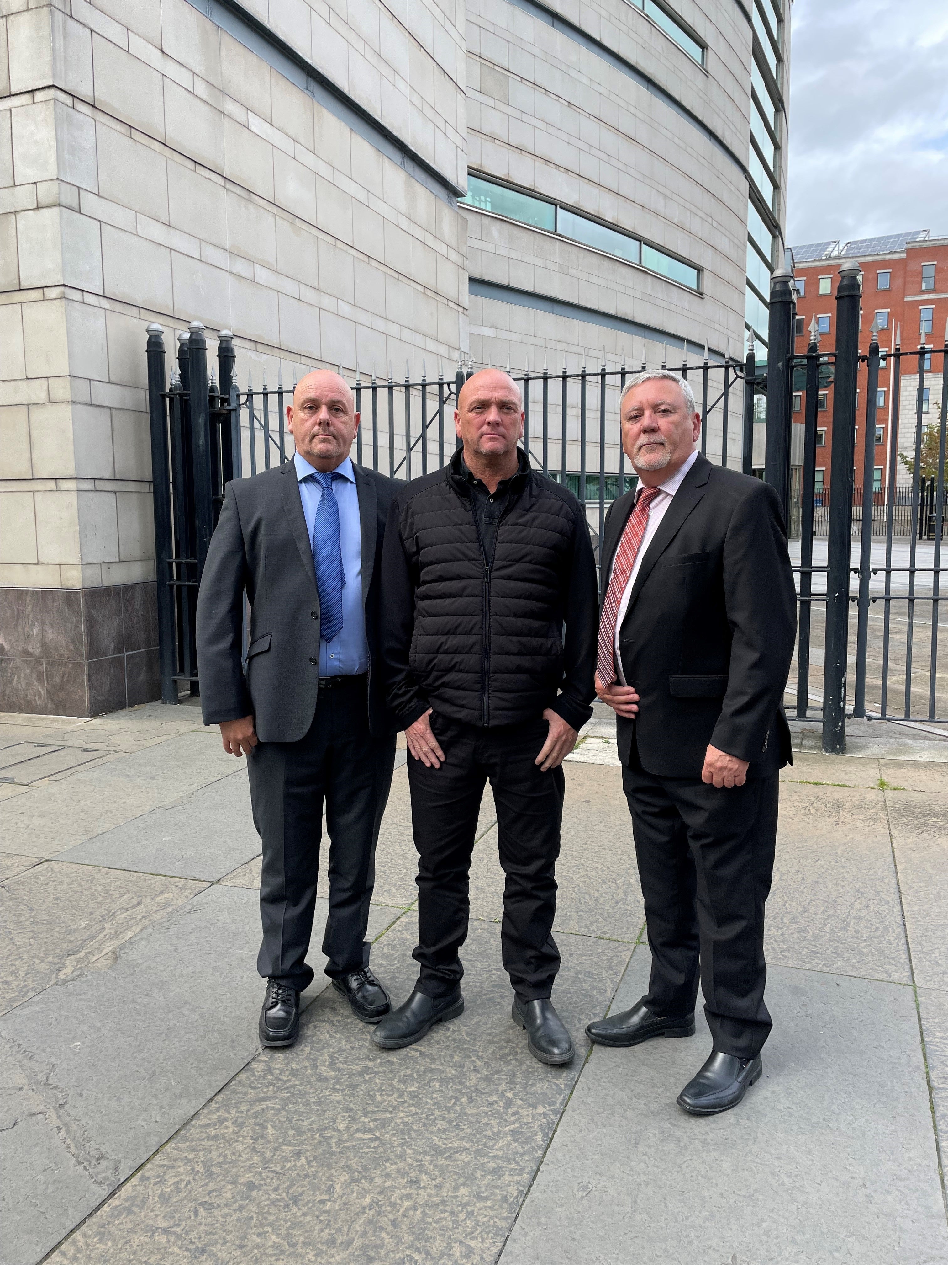 Left to right Kieran, Joseph and Jim Geddis outside Laganside courts in Belfast after the findings were delivered in the inquest for their brother Stephen Geddis (David Young/PA)