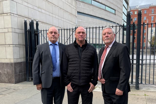 Left to right Kieran, Joseph and Jim Geddis outside Laganside courts in Belfast after the findings were delivered in the inquest for their brother Stephen Geddis (David Young/PA)