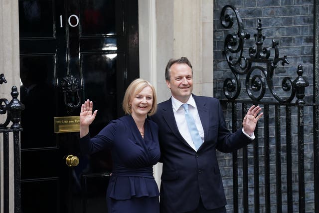 New Prime Minister Liz Truss makes a speech outside 10 Downing Street with her husband (PA)