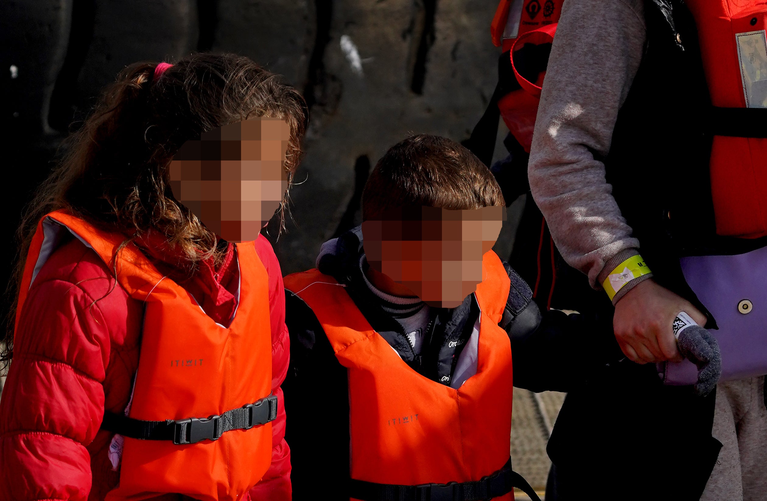 Children wrapped in blankets and wearing life jackets arrived on the south coast as the number of Channel crossings in 2022 so far edged closer to topping last year’s total (Gareth Fuller/PA)