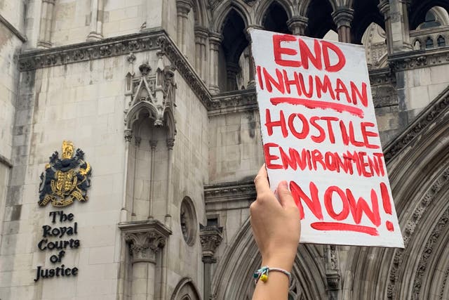 Demonstrators outside the Royal Courts of Justice, central London, protesting against the Government’s plan to send some asylum seekers to Rwanda, while a High Court hearing over the policy is ongoing (Tom Pilgrim/PA)