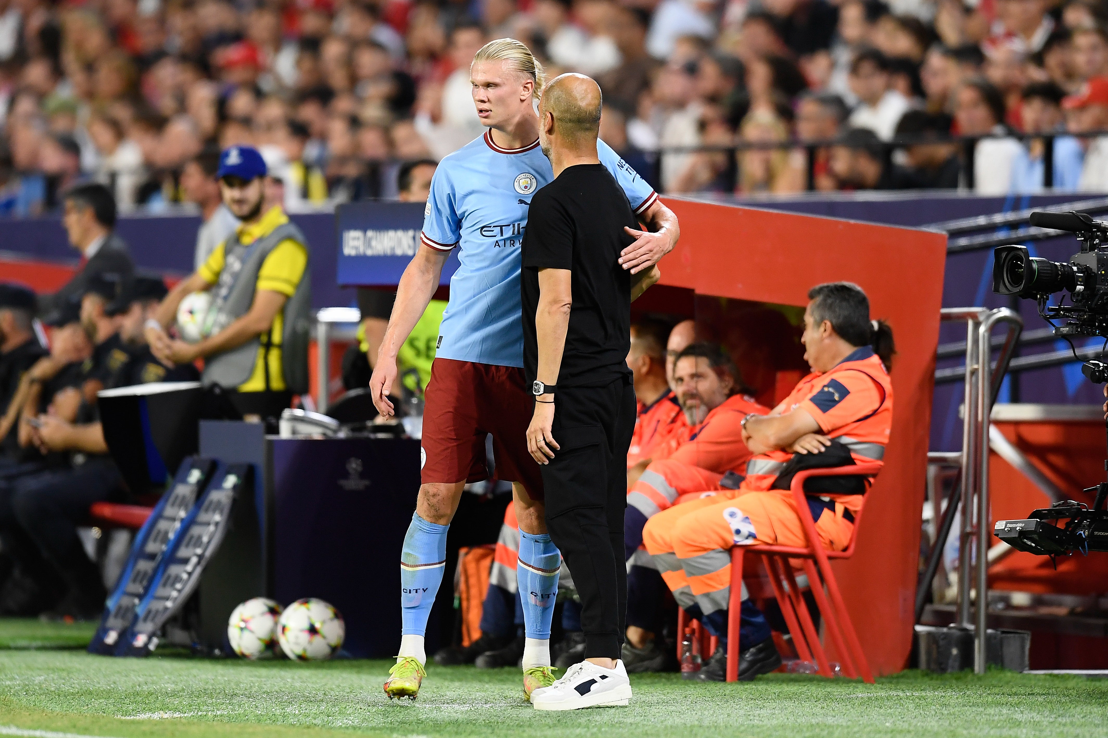 Pep Guardiola, right, gives instructions to Erling Haaland (Jose Breton/AP)