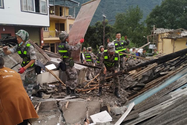 <p>In this photo released by Xinhua News Agency, soldiers clear debris to search for survivors at an earthquake hit Moxi Town of Luding County, southwest China’s Sichuan Province Tuesday, 6 September 2022</p>