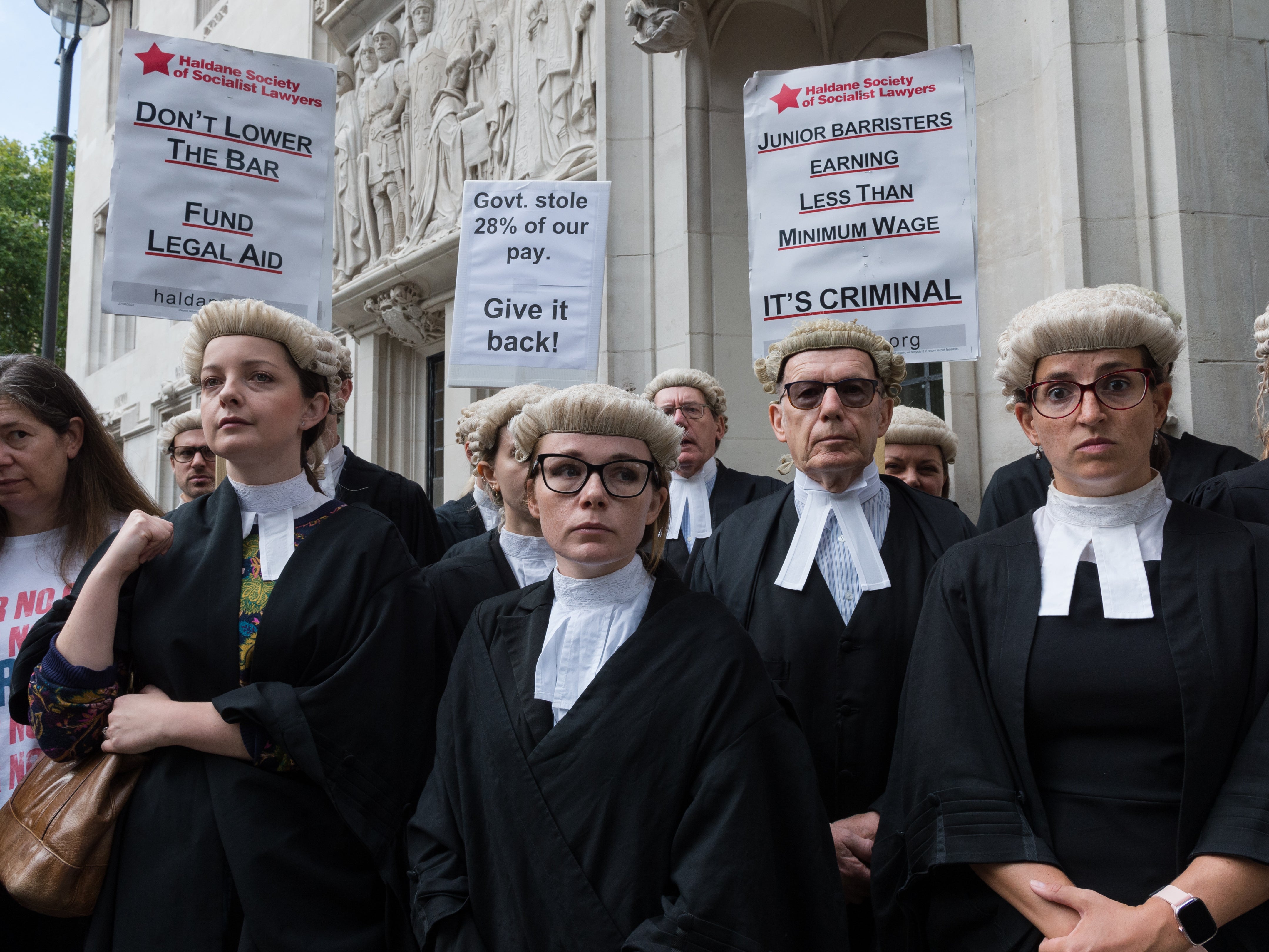 Criminal barristers gather outside the Supreme Court for a rally following the start of an indefinite strike action on 6 September 2022