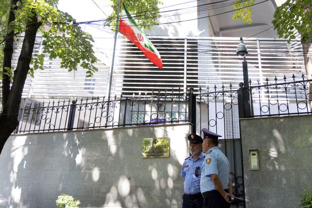 <p>Policemen stand guard outside the Iranian embassy in Tirana</p>