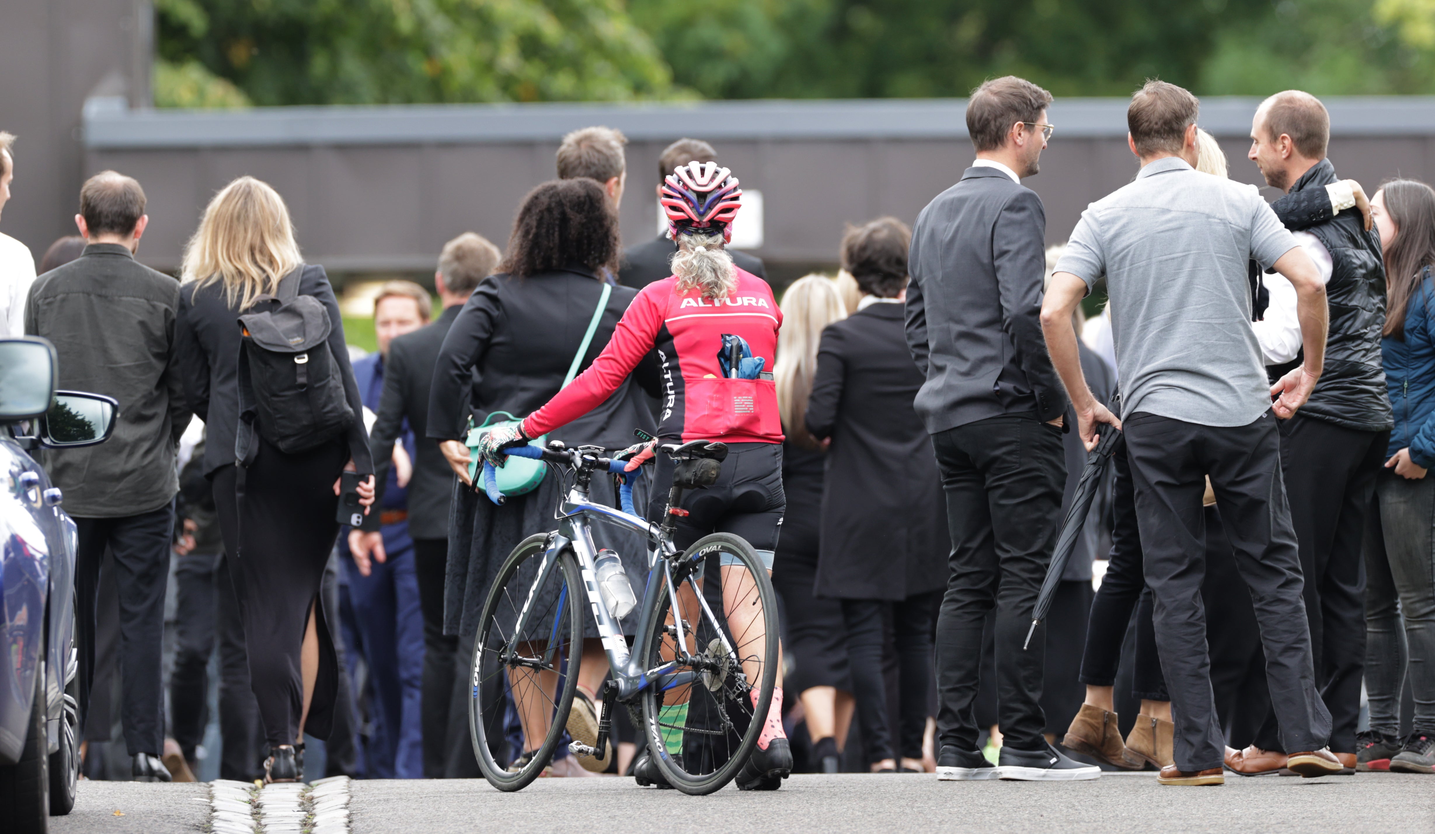 A cyclist among mourners outside the funeral for Rab Wardell (Steve Welsh/PA)