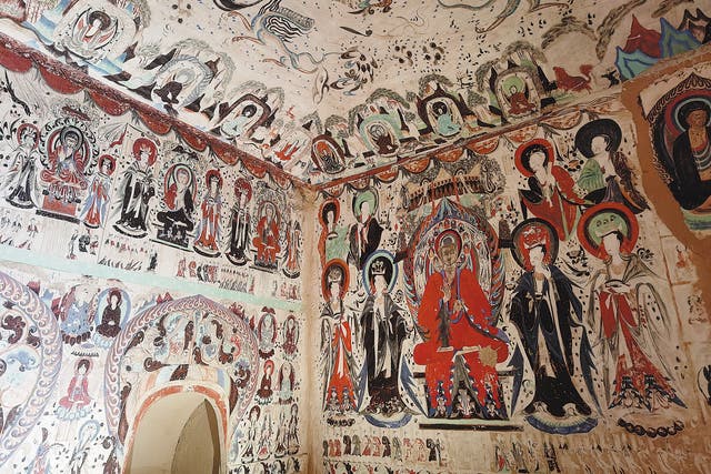<p>The Mogao Caves are home to numerous exquisite statues, murals and precious documents that mark cultural exchanges along the ancient Silk Road</p>