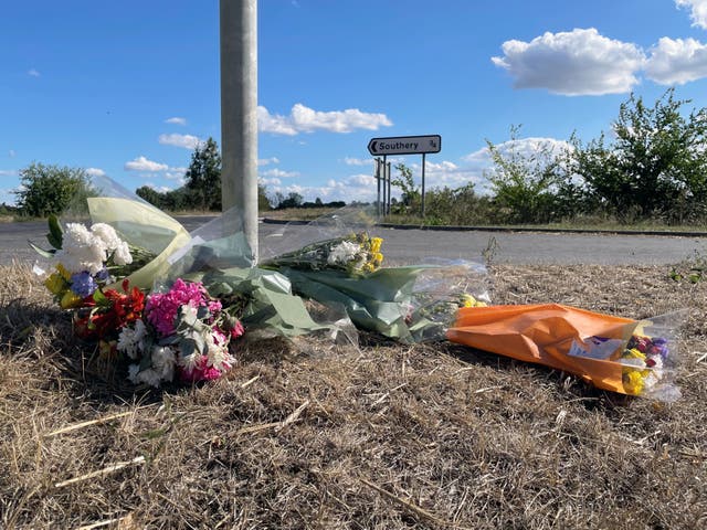 Flowers left at the side of the A10 at Southery in Norfolk (Sam Russell/PA)
