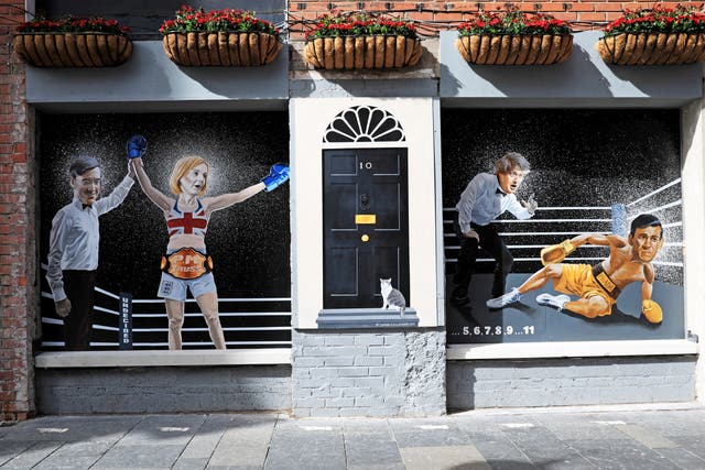 A mural depicting Liz Truss being declared a winner by Jacob Rees-Mogg after beating Rishi Sunak (Peter Morrison/PA)