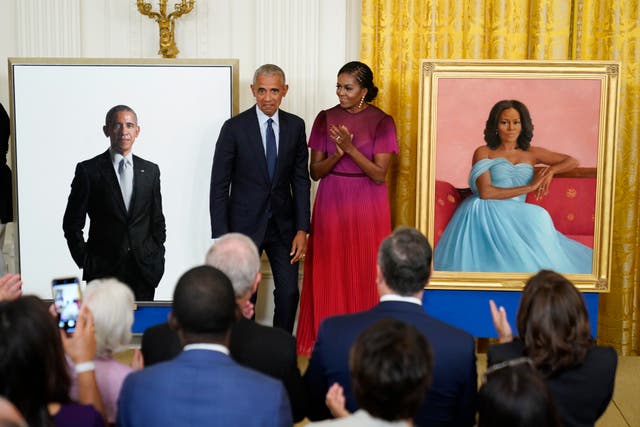 <p>Former President Barack Obama and former first lady Michelle Obama react after unveiling their official White House portraits</p>