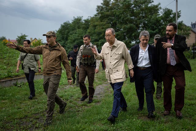 <p>Former UN secretary general Ban Ki-moon, centre, and Colombia’s former president Juan Manuel Santos, centre right, on a visit to Bucha near Kyiv, Ukraine</p>