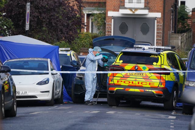 A forensics officer at the scene in Kirkstall Gardens (Jonathan Brady/PA)