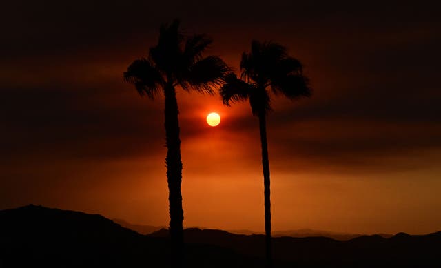<p>The sun sets during a dangerous heatwave in California last month </p>