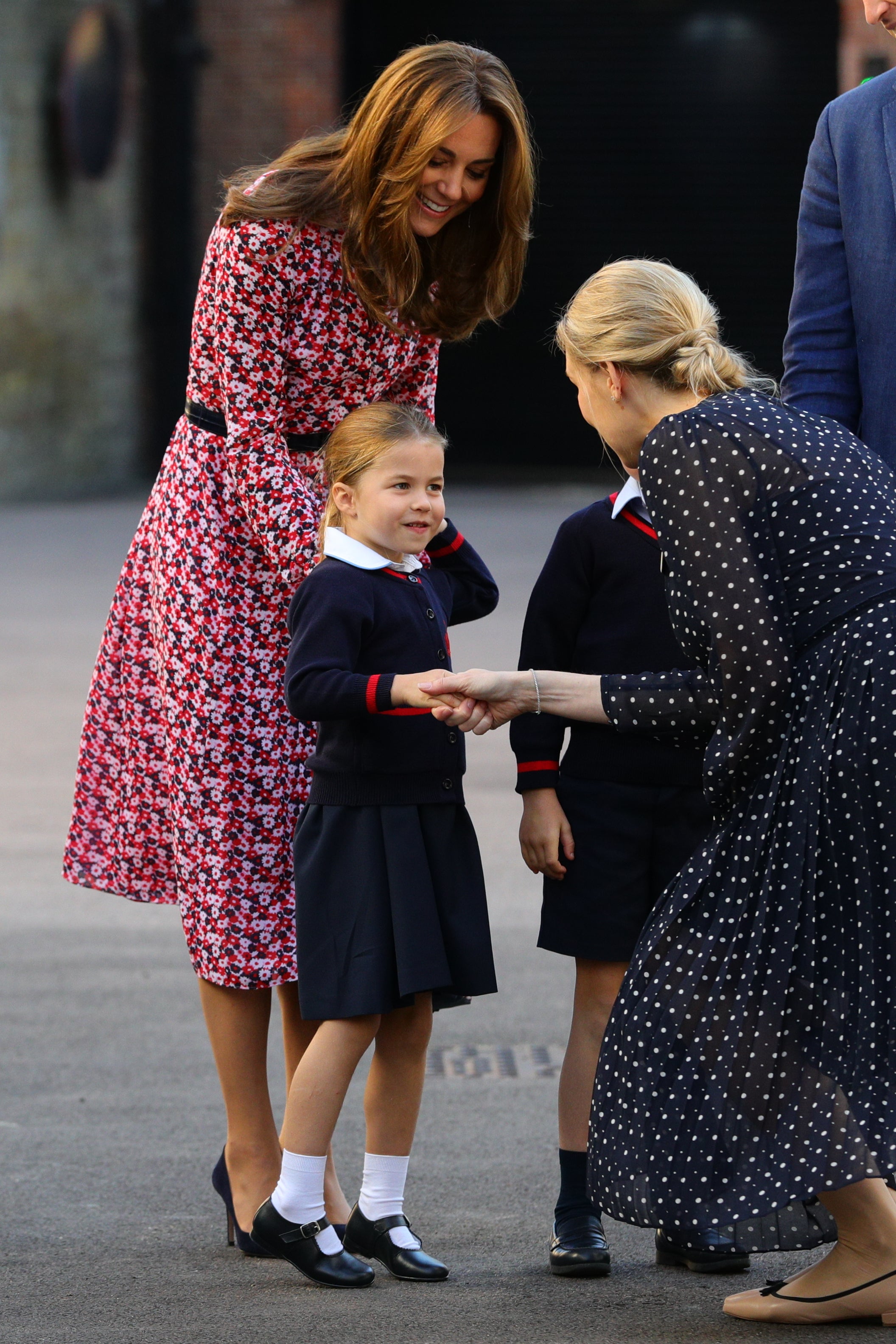 Helen Haslem, head of the lower school at Thomas’s Battersea, greets Princess Charlotte on her first day (Aaron Chown/PA)