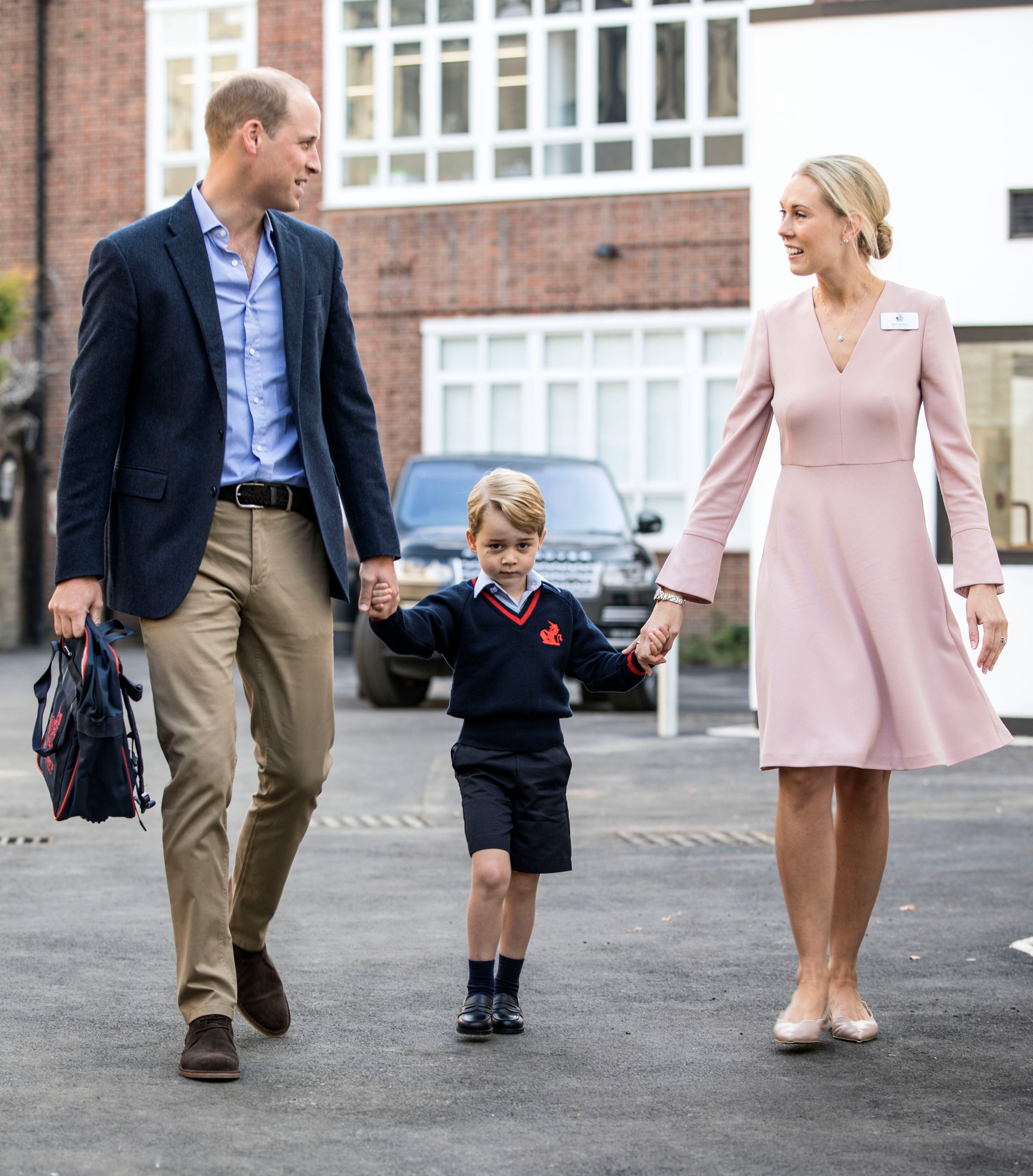 Prince George with his father and Thomas’s Battersea lower school head Helen Haslem (Richard Pohle/The Times/PA)