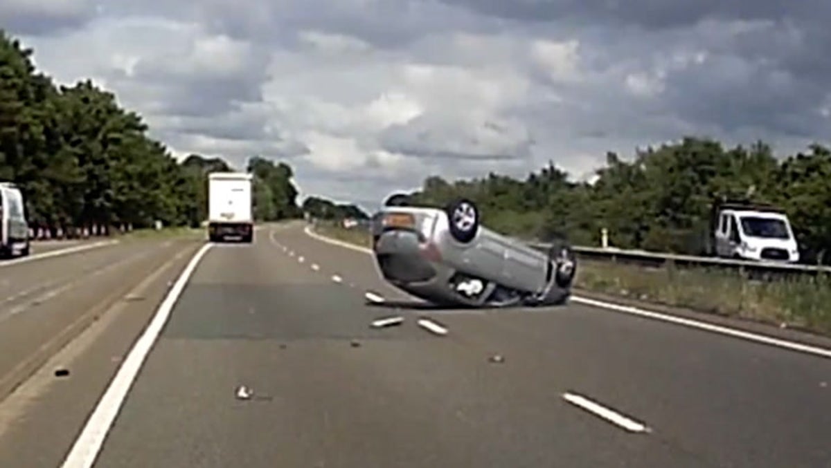 Shocking moment drunk driver collides with a lorry and flips car over