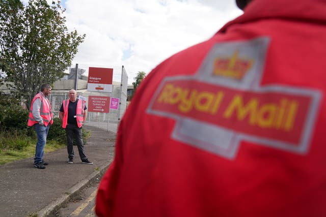 Royal Mail staff from the Communication Workers Union are on strike in a dispute over pay and conditions (Andrew Milligan/PA)