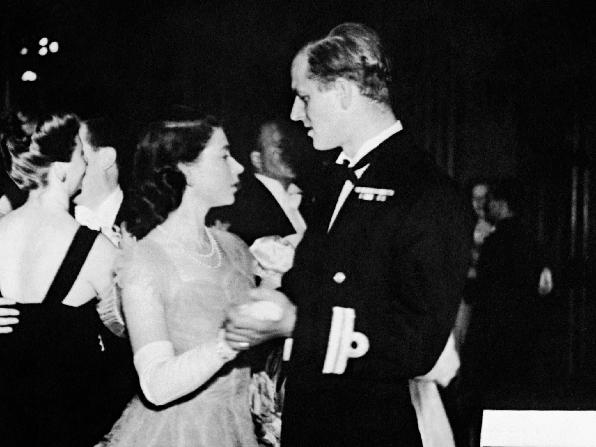 Dancing with her then-fiance, Philip Mountbatten, at the Assembly Rooms, Edinburgh