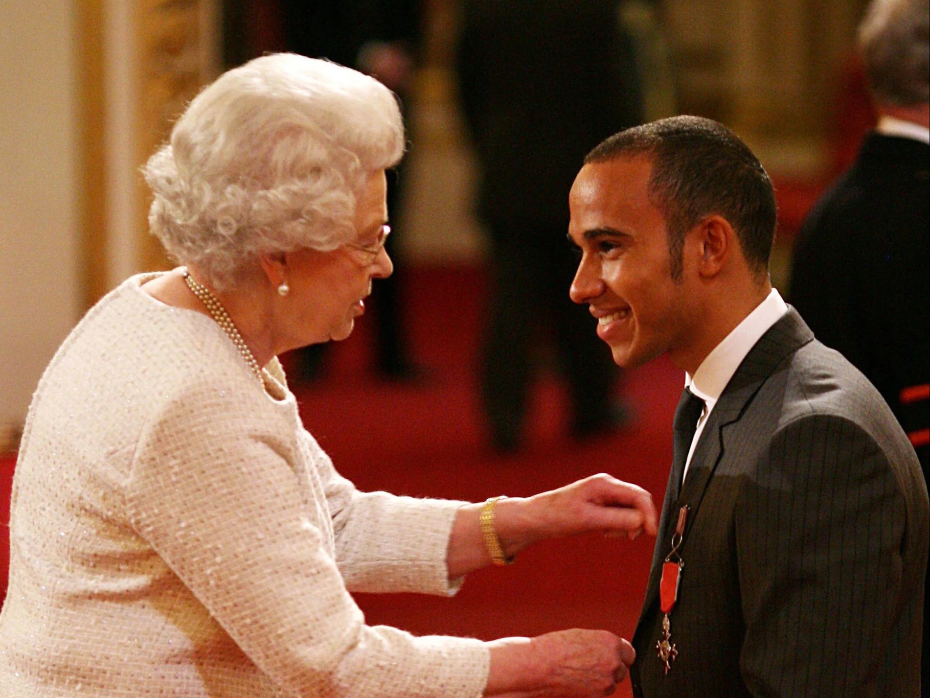 Sir Lewis Hamilton, right, is wishing the Queen well amid serious health concerns for the monarch