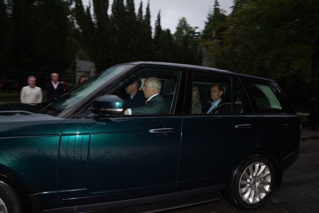 The Duke of Cambridge drives a car carrying the Duke of York, and the Earl and Countess of Wessex into Balmoral in Scotland, where the Queen is under medical supervision (Andrew Milligan/PA)