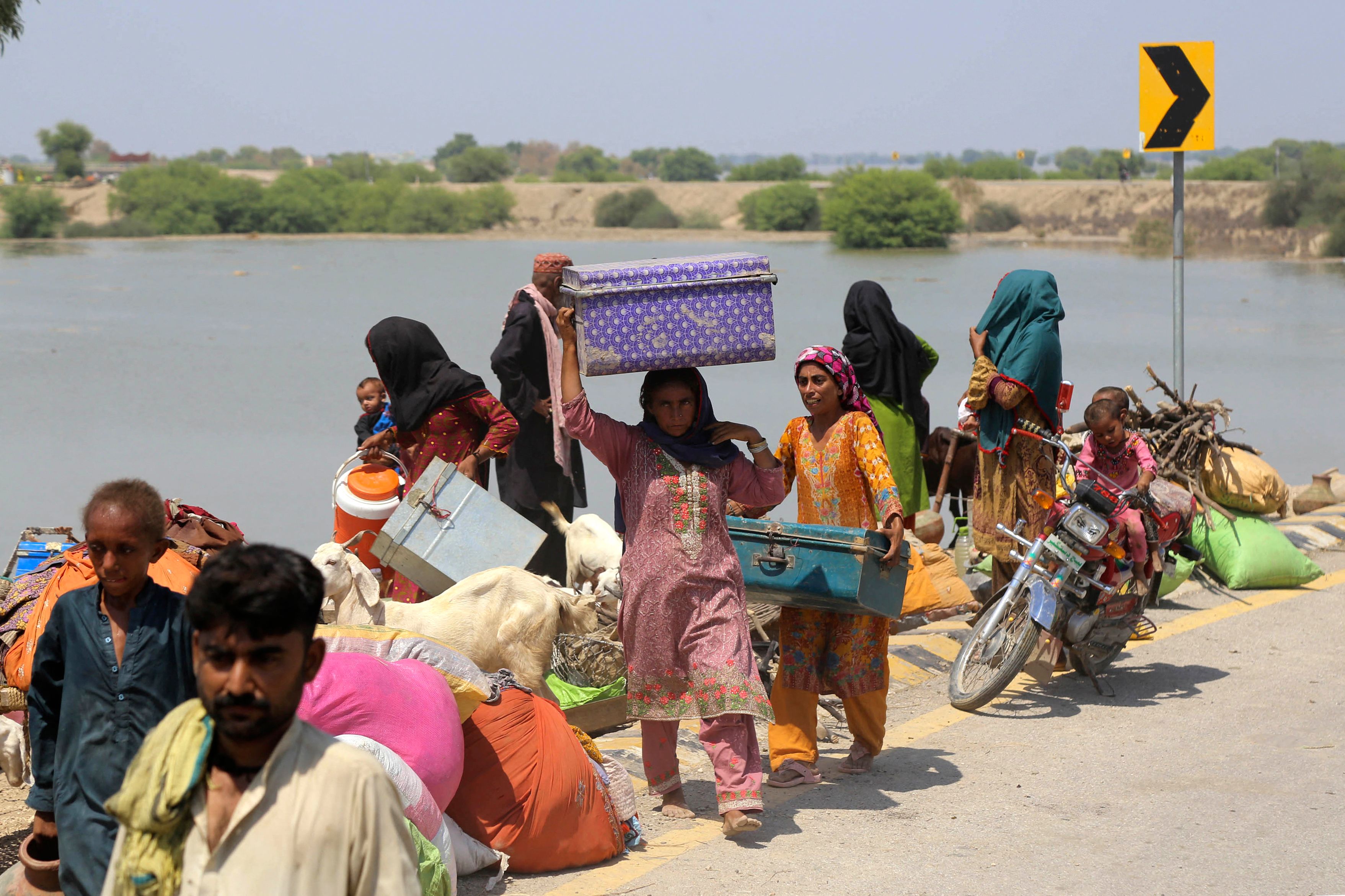 People move from flooded areas to safer ground in Sehwan, Jamshoro district, Sindh