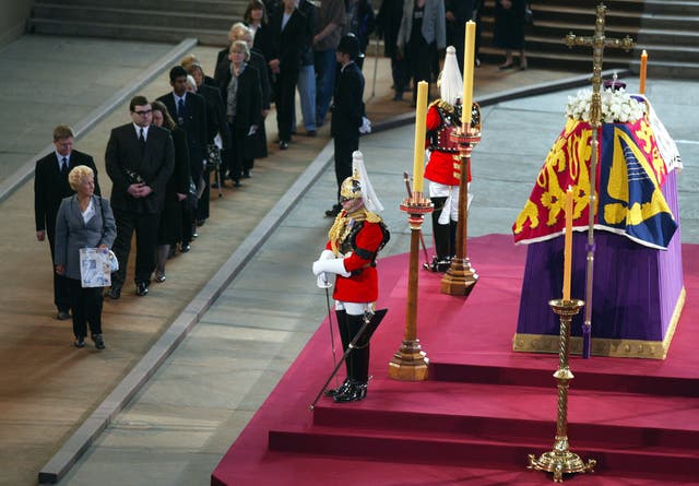 Mourners queue to file past the coffin of the Queen Mother (Phil Noble/PA)